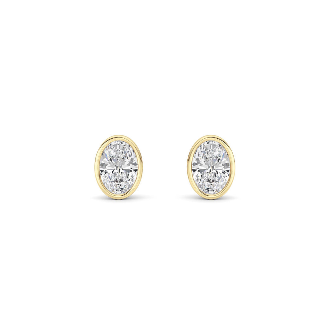 1Cttw Oval Shaped Lab Grown Diamond (F/VS) Bezel Set Stud Earrings in 14K Gold
