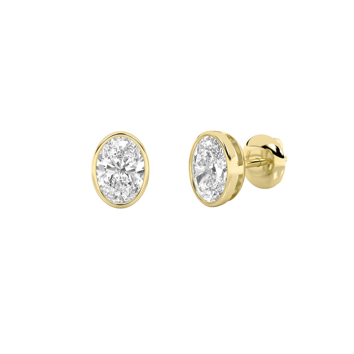 1Cttw Oval Shaped Lab Grown Diamond (G/VS) Bezel Set Stud Earrings in 14K Gold